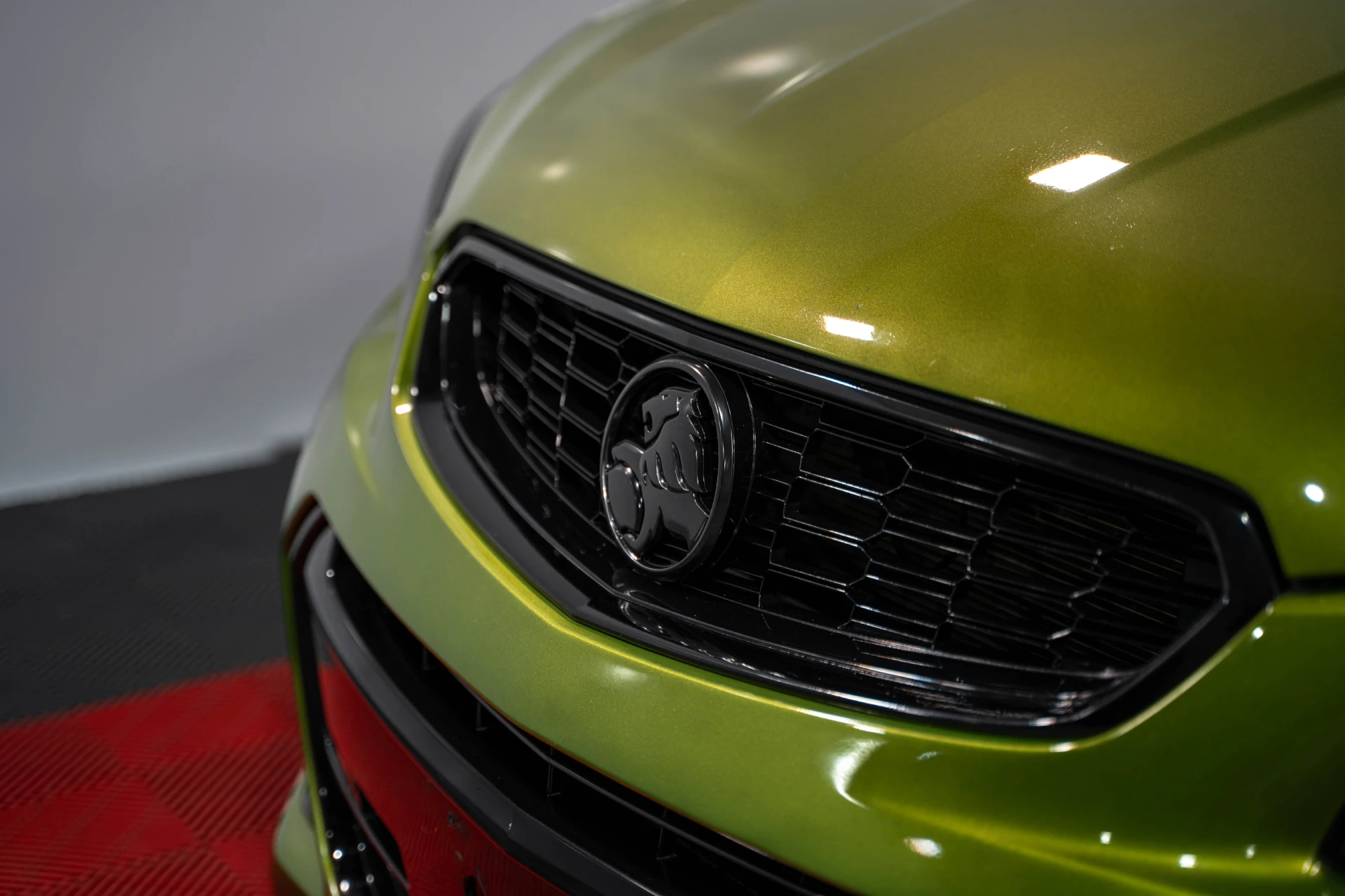 Polished green Holden front grille after pre sale paint detailing