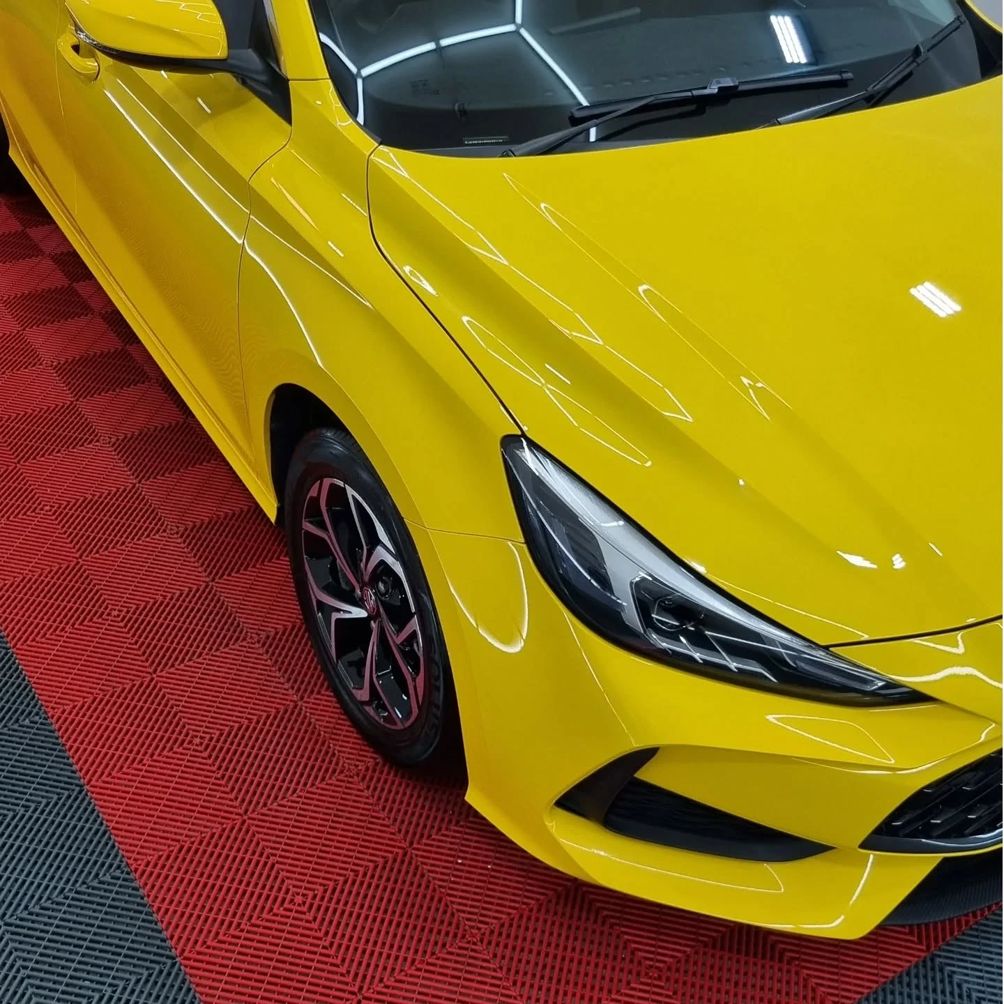 Ceramic-coated vehicle with water beading on the paint
