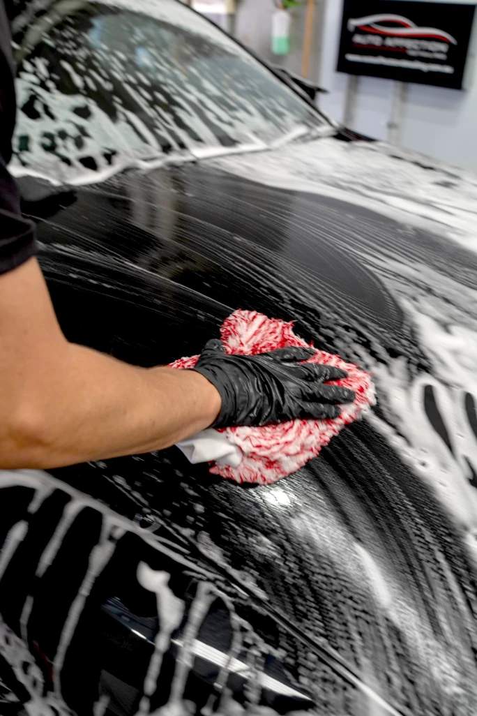 Hand washing a vehicle during pre sale detailing at Auto Affection Detailing