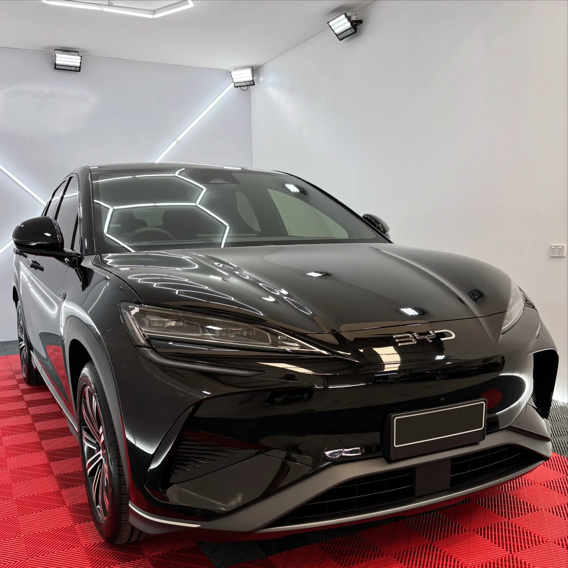 Black BYD electric SUV with a mirror-gloss finish after ceramic coating